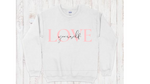 White crewneck sweatshirt with "love yourself" quote in pink and black lettering