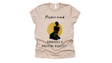 Short sleeve t-shirt with graphic of woman's body and "positive mind produces a positive reality" quote