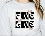 White crewneck sweatshirt with "fine line" quote and butterflies graphic