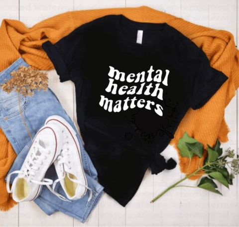 Black t-shirt with white "mental health matters" quote