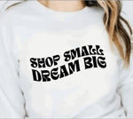 White crewneck sweatshirt with "shop small dream big" quote