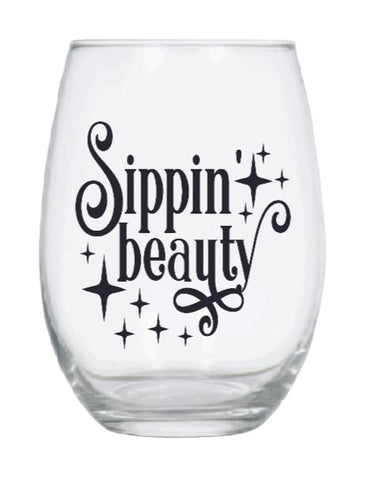 Stemless wine glass with black Sippin Beauty quote