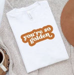White shirt with "you're so golden" quote