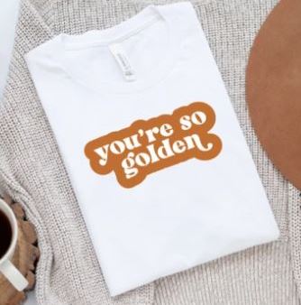 White shirt with "you're so golden" quote